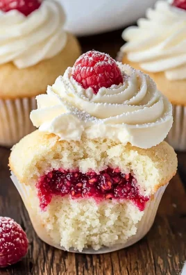 Almond Wedding Cake Cupcakes with Raspberry Filling