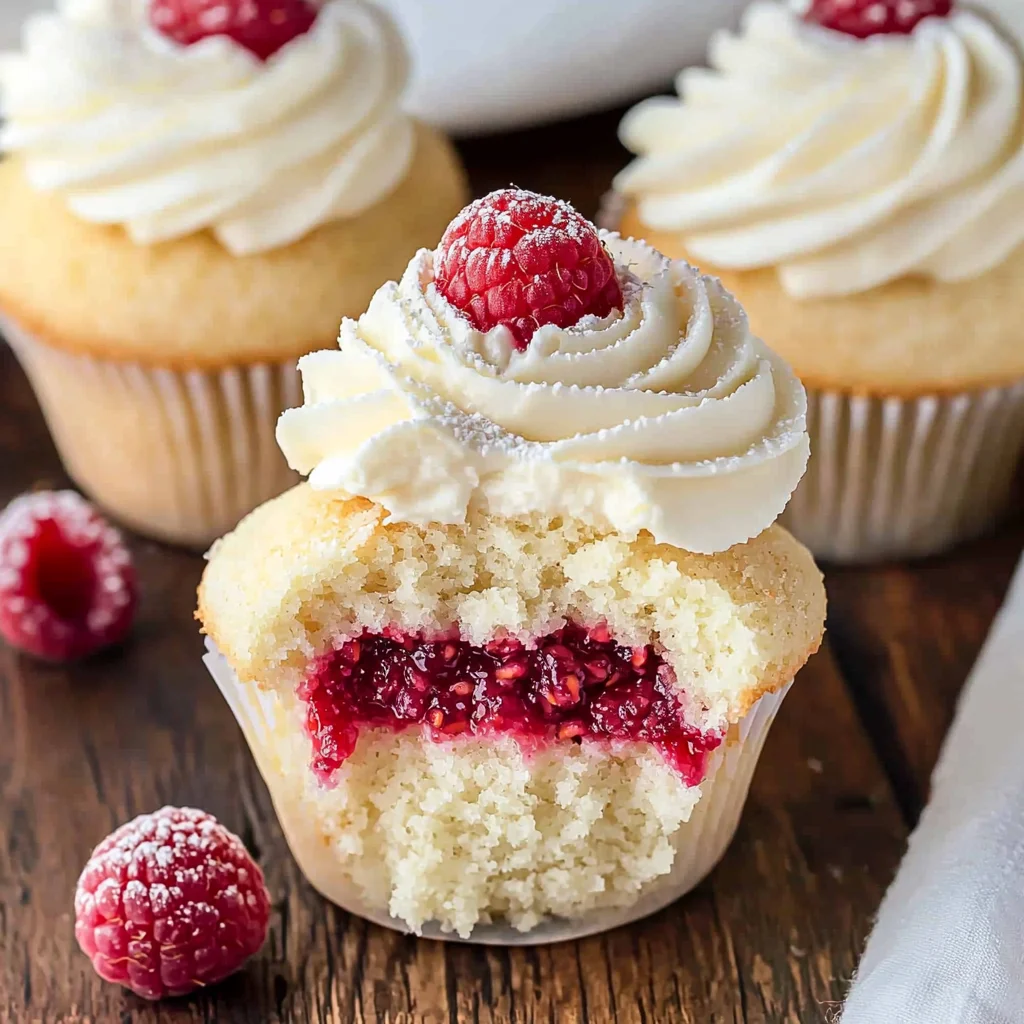 Almond Wedding Cake Cupcakes with Raspberry Filling